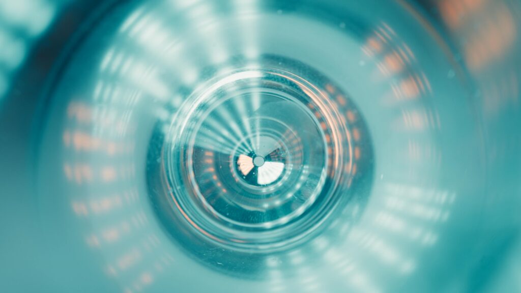 Abstract image showcasing a tunnel-like view with colorful futuristic lighting patterns.