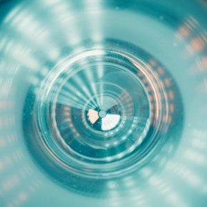 Abstract image showcasing a tunnel-like view with colorful futuristic lighting patterns.